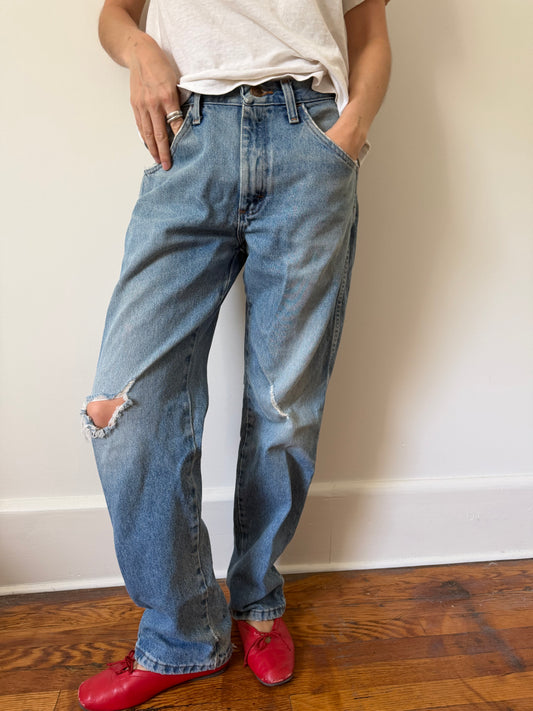 Distressed and Faded Rustler Denim
