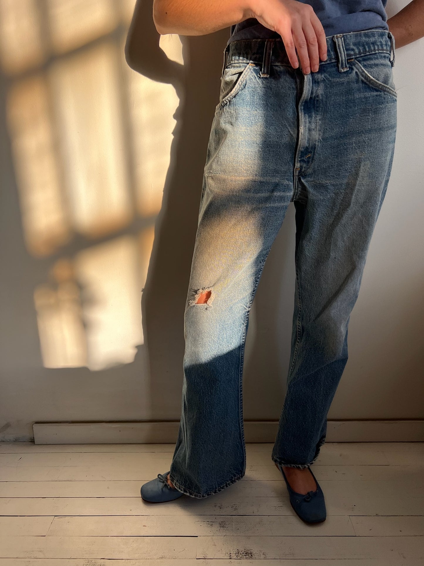Faded and Distressed Orange Tab Levi’s