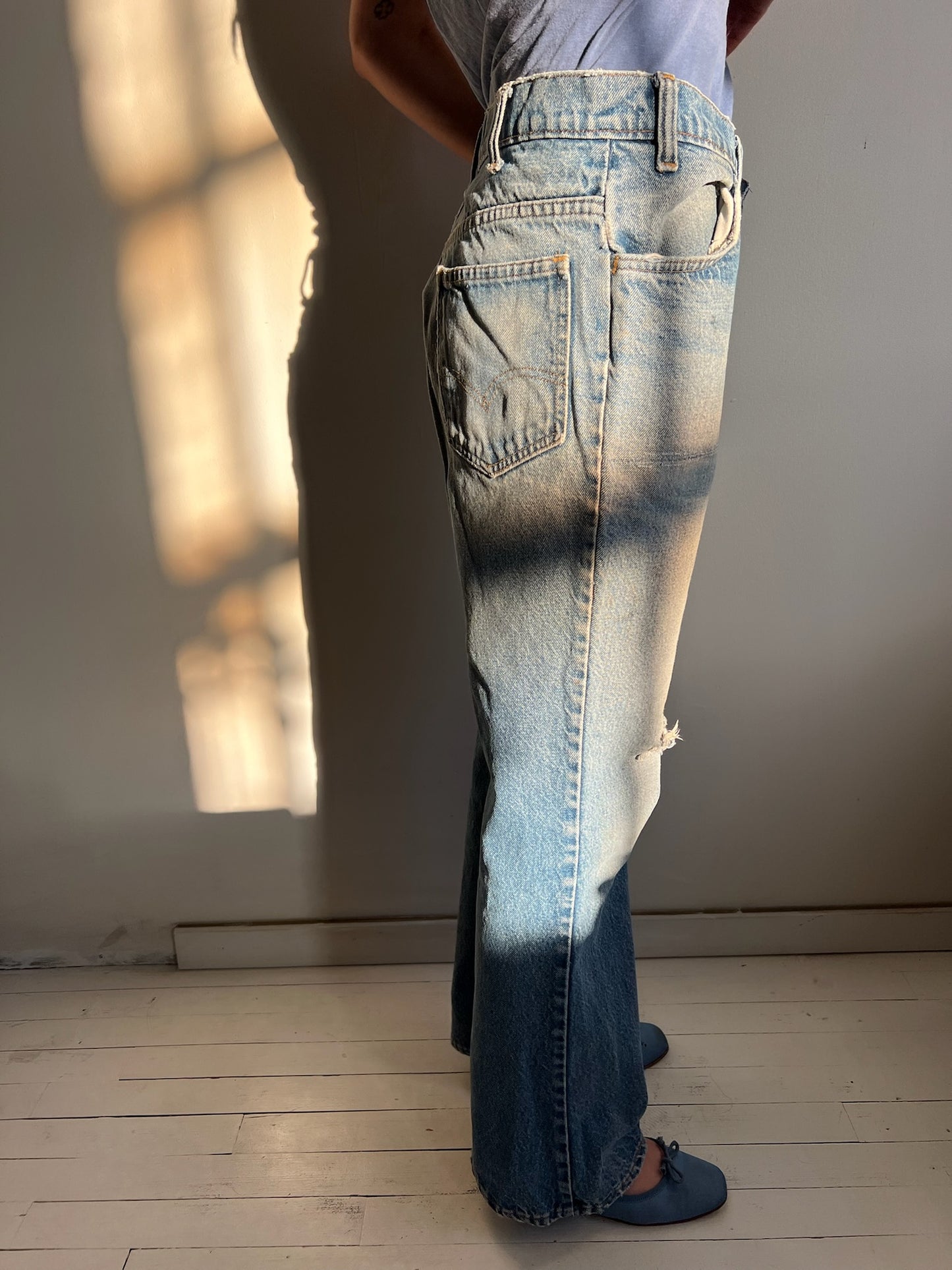Faded and Distressed Orange Tab Levi’s